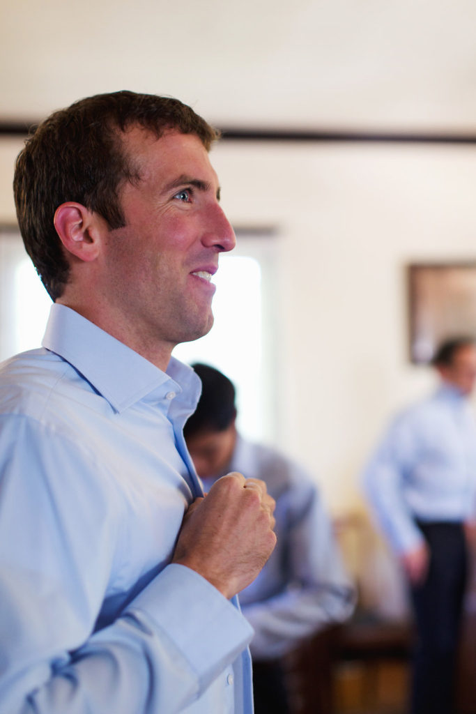 Groom buttoning up